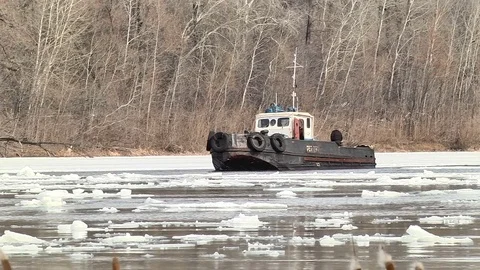 Icebreaker breaks a path in the ice Stock Footage 74244141