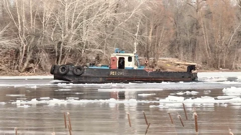 Icebreaker breaks a path in the ice Stock Footage 74247257