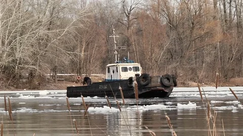 Icebreaker breaks a path in the ice Stock Footage 74248984