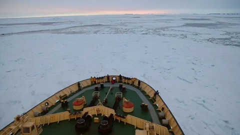 Icebreaker breaks through ice Stock Footage 104995697