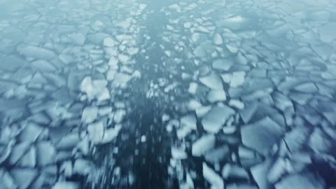 Icebreaker’s way through cracked thin ice on the river Stock Footage 226915109