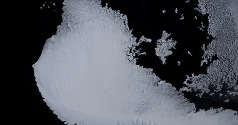 Icecaps / iceberg melting from space / white ink on black / Global warming Stock Footage 114103169