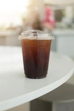 An iced Americano sits on a table, capturing the essence of a refreshing su.. Stock Photos