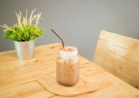 Iced cofee mocha drink serving on wooden table Stock Photos