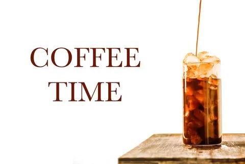 Iced coffee with crashed ice, coffee is pouring, on wooden table top, isolated Stock Photos