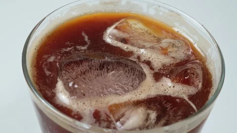 Iced coffee in a glass Video stock 334864053