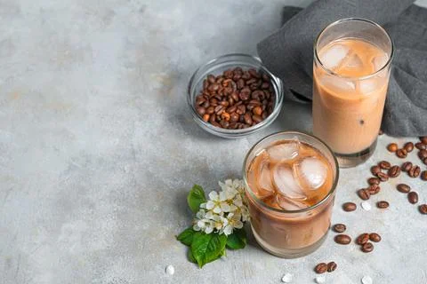 Iced coffee on a gray background with space to copy. Stock Photos