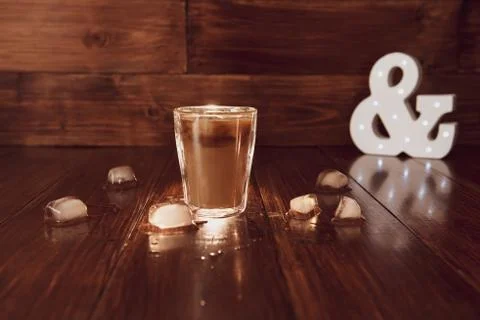 Iced coffee with ice on table Stock Photos