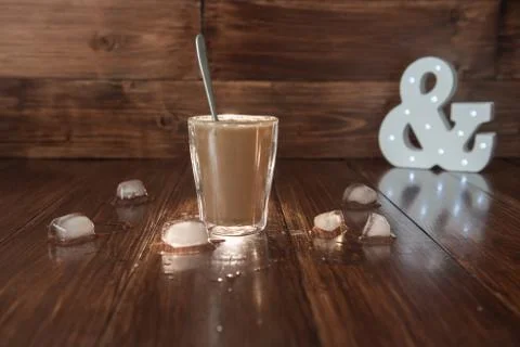 Iced coffee with ice on table Stock Photos
