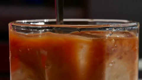 Iced coffee with milk. Closeup. Stock Footage 156936248