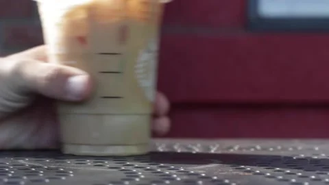 Iced Coffee Passed Quickly, Left to Right Stock Footage 134739040