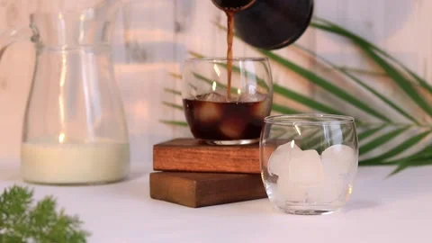 Iced coffee. Preparation of a summer soft drink from coffee Stock Footage 232236591