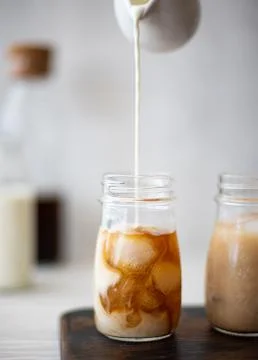 Iced coffee in small jars Foto stock