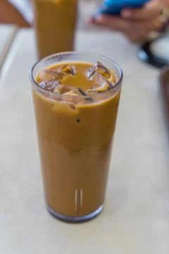 Iced coffee on white table Stock Photos