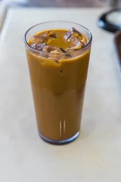 Iced coffee on white table Stock Photos