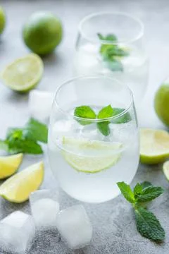 Iced cold lemonade with fresh lime and juice Stock Photos