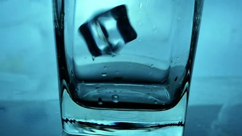 Iced cube pour water Stock Footage 107399638