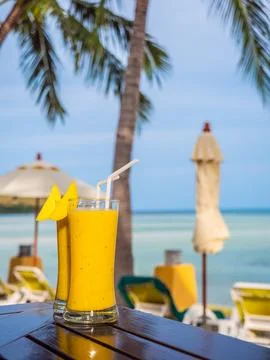 Iced drinking glass with mango smoothies Stock Photos
