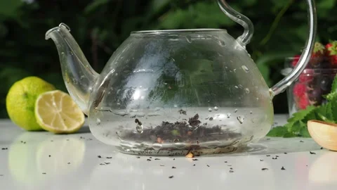 Iced fruit tea cold berry drink in clear glass mint leaf Refreshing summer drink 動画素材 168018855