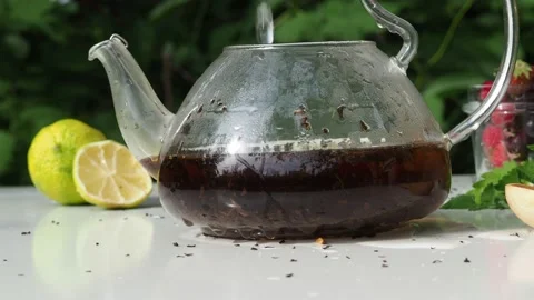 Iced fruit tea cold berry drink in clear glass mint leaf Refreshing summer drink 動画素材 168018871