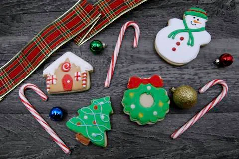 Iced Gingerbread cookie flat lay with decorations on wood Stock Photos