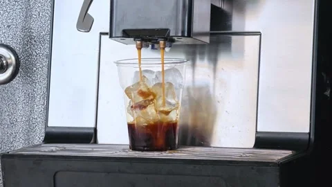 Iced latte coffee. Ice Coffee preparation. Coffee machine. Stock Footage 311430877