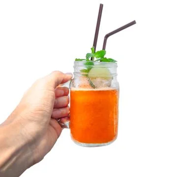 Iced lemon black tea with mint and slice lemon in vintage mason jar isolate o Stock Photos