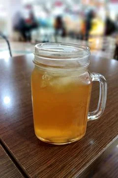 Iced lemon tea in a drinking jar Stock Photos