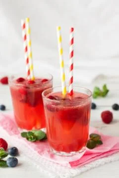 Iced lemonade with berries Stock Photos