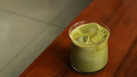 Iced Matcha Latte with Ice Cubes Stock Photos