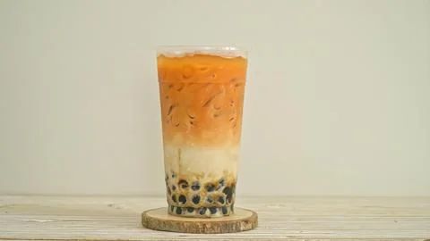 Iced passion fruit tea with tapioca pearls in a tall glass Stock Photos