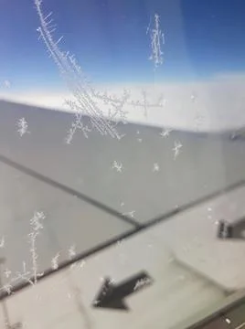 An iced plane window in a flight. Foto stock