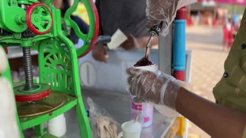 Iced Popsicle Serving. Indian Ice Gola. 4K Stock Footage 240300843