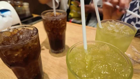 Iced Tea and Soda Beverages on Restaurant Table with People Stock Footage 339752201