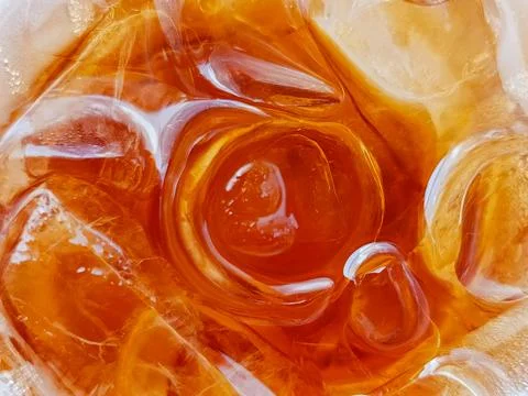 Iced Tea Close Up with Ice Cubes, Refreshing Cold Drink Background, Amber Liquid 스톡 사진