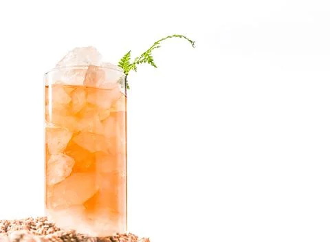 Iced tea with crashed ice in a transparent tall glass isolated over white Stock Photos