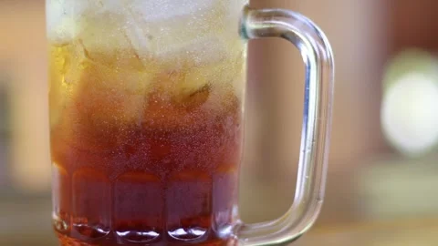 Iced tea drink served in a large glass glass Stock Footage 300622204