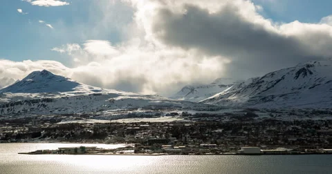Iceland, Akureyi Clouds rolling over mountains in winter 스톡 동영상 61782164