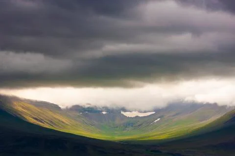 Iceland / Clouds envelop a mountain Stock Photos