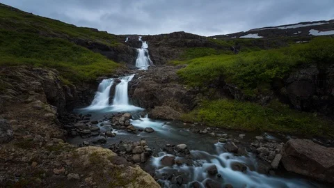 Iceland - Dark Clouds Over Waterfall - 4K Timelapse Stock Footage 117532170