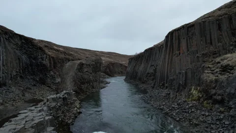 Iceland Drone inside Studlagil Canyon, flying over rapids 4K Video stock 242120705