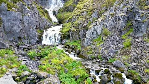 Iceland - Drone over Fjord Version 5 Top of Mini Waterfall Stock Footage 210201007
