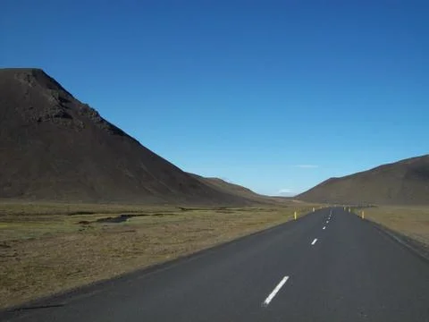 Iceland road 1 completely empty  road and clear blue sky Stock Photos