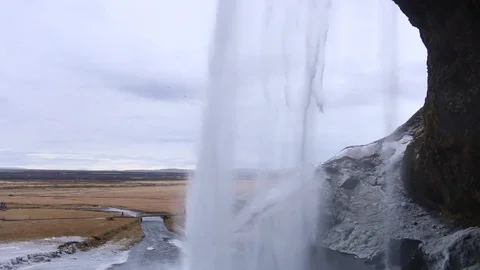 Iceland Seljalandsfoss from behind backside under the waterfall south coast.. Stock Footage 72918875
