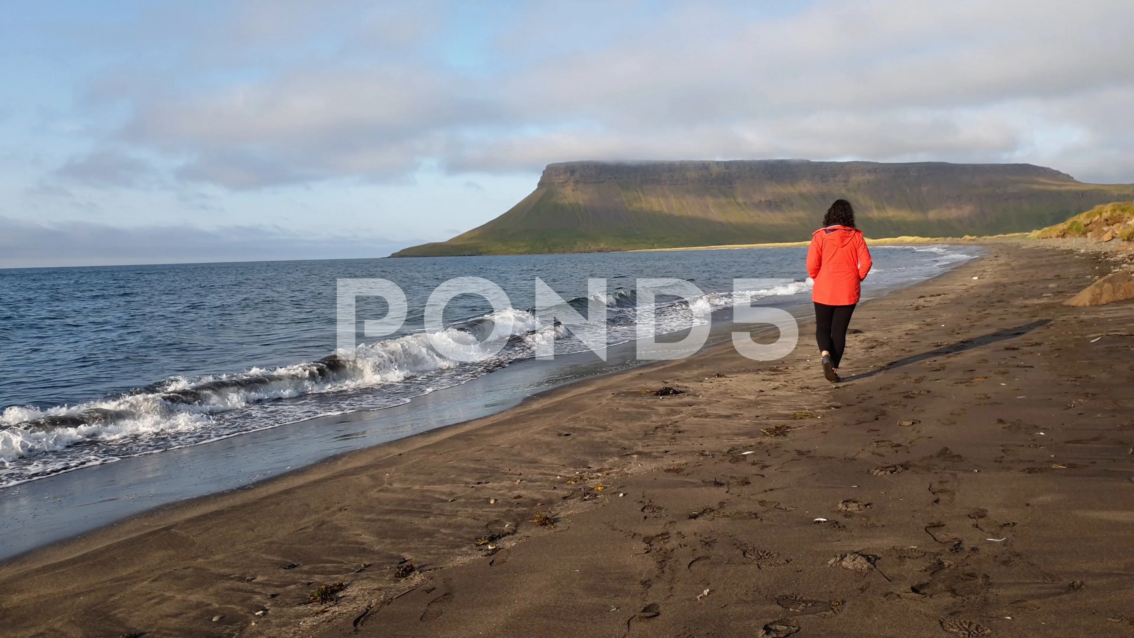 Iceland Tourist Woman Walking On The Giant Padlock Beach Snæfellsnesvegur,