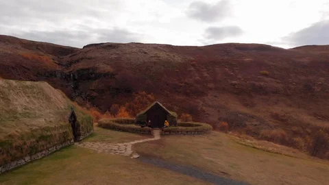 Iceland turf houses drone backwards reveal Stock Footage