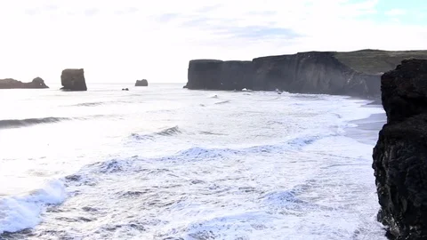 Iceland vik south coast cliffs on the coast shore ocean and waves and sunsh.. Stock Footage 72927573