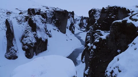 Iceland Winter View Of Large Snow Covered Valley With Rushing Water Below 2 Stock Footage 87490016