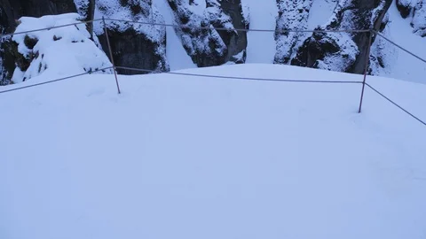 Iceland Winter View Of Large Snow Covered Valley With Rushing Water Below 5 Stock Footage 87490091