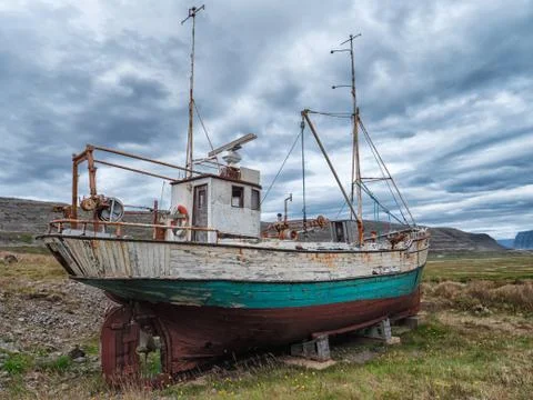 Icelandic fishing boat used as a vehicle for finding fish parket on the beach Stock Photos